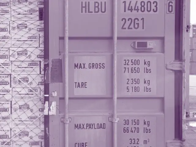 A shipping container loaded with palletised Black Sand stock