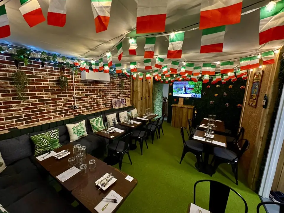 The tasting room at Givino decked in Italian flags, tables laid for an evening event