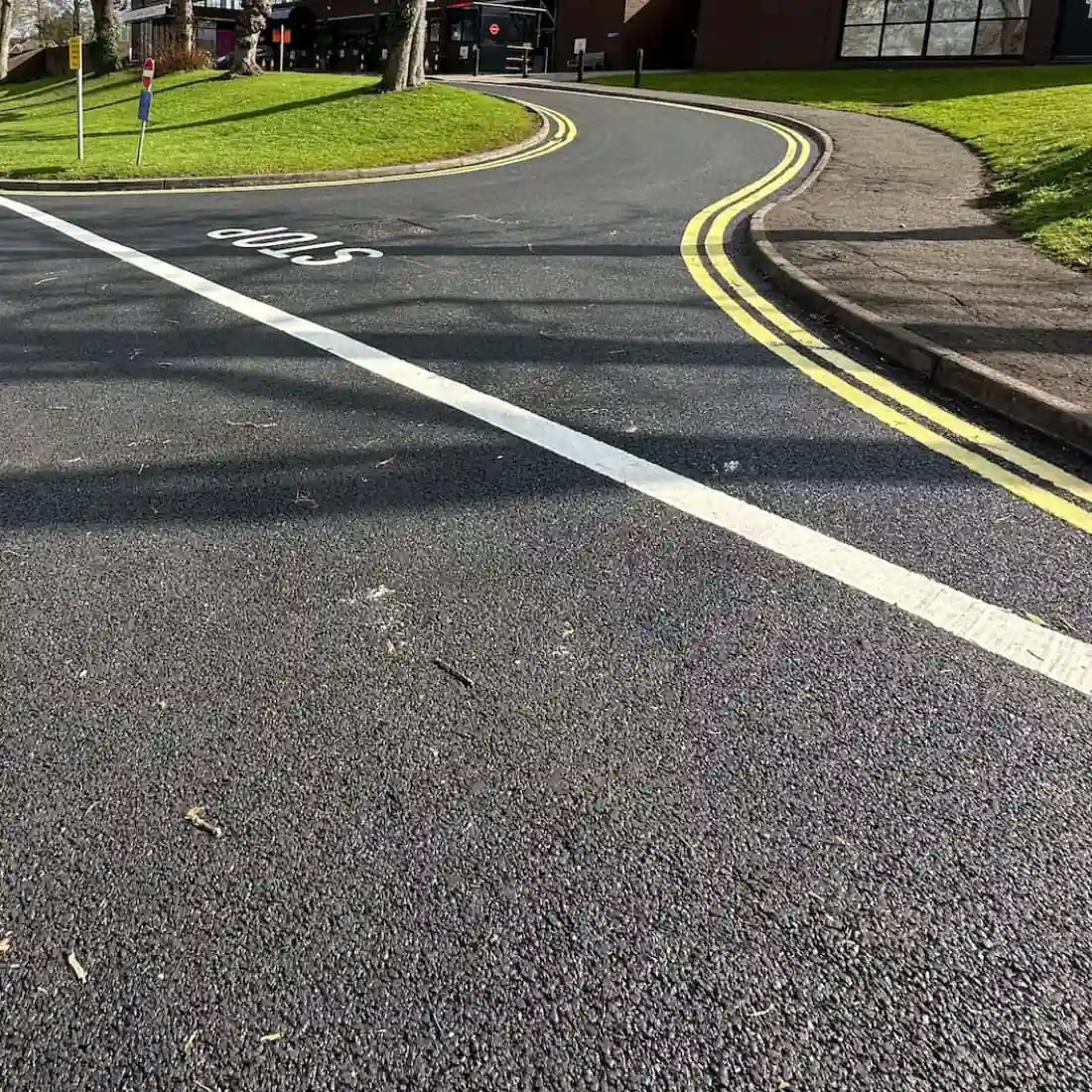 A Smart Surfacing crew laying fresh tarmac