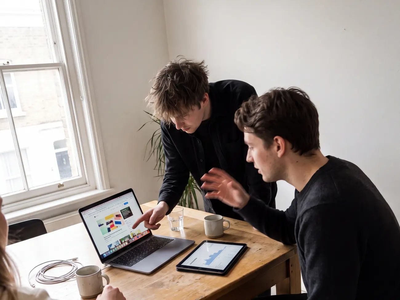 Colleagues working together around a table in a studio