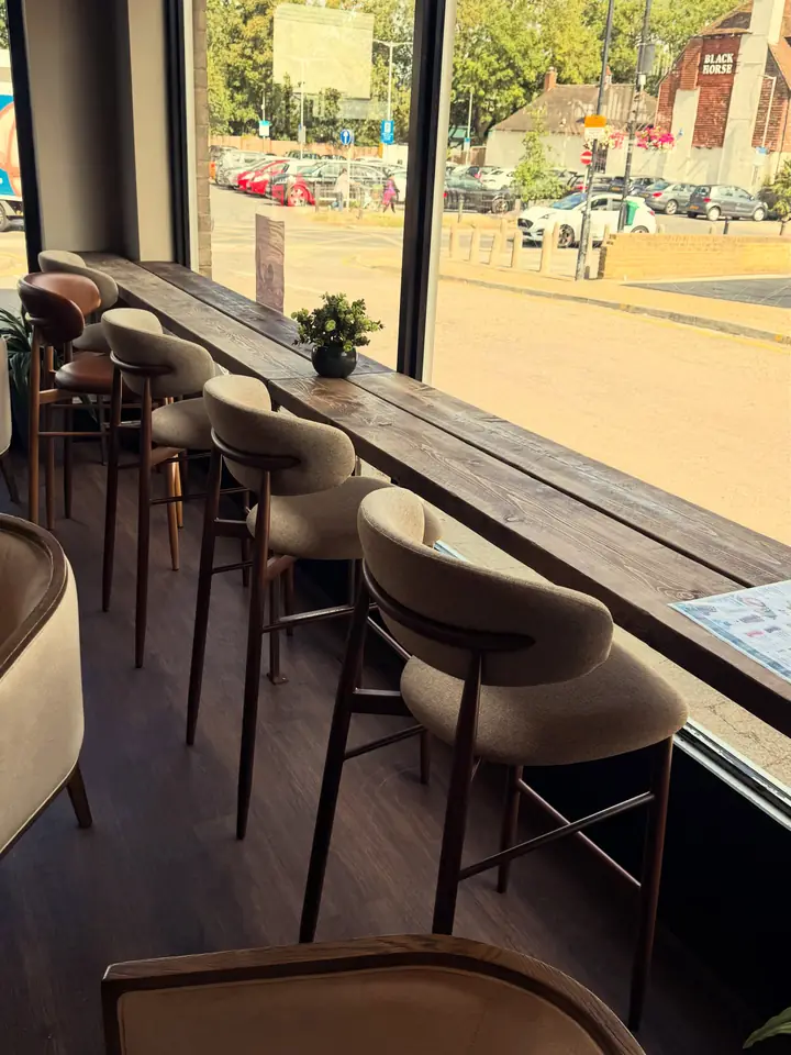 The window bar at The Artisan Coffee House, stools looking out onto the street