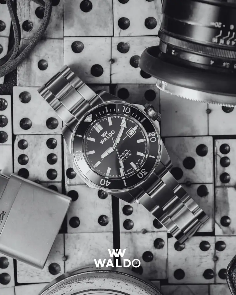 A Waldo watch among dominoes, in black and white