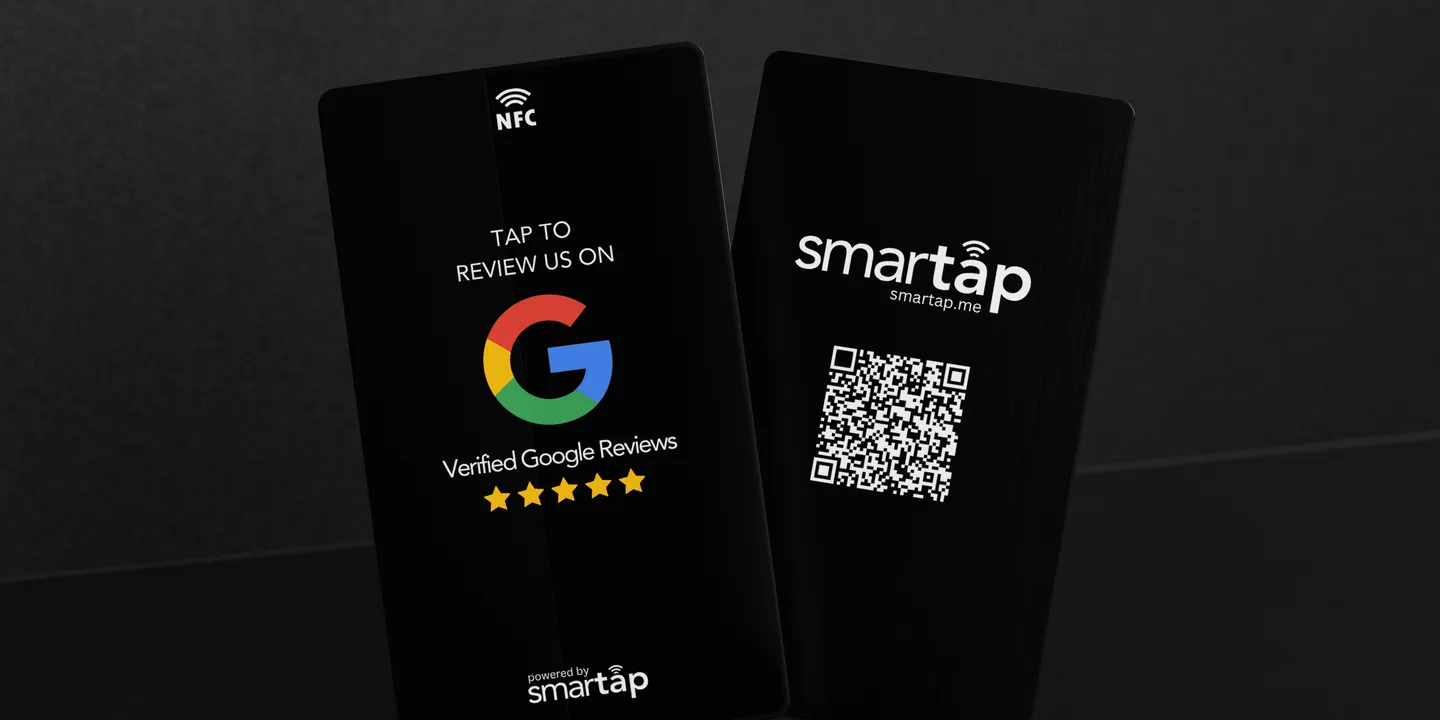 Two black metal Smartap cards, one printed "Tap to review us on Google", the other with a QR code