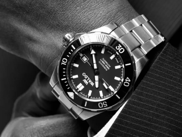 A Waldo dive watch worn on the wrist, close up