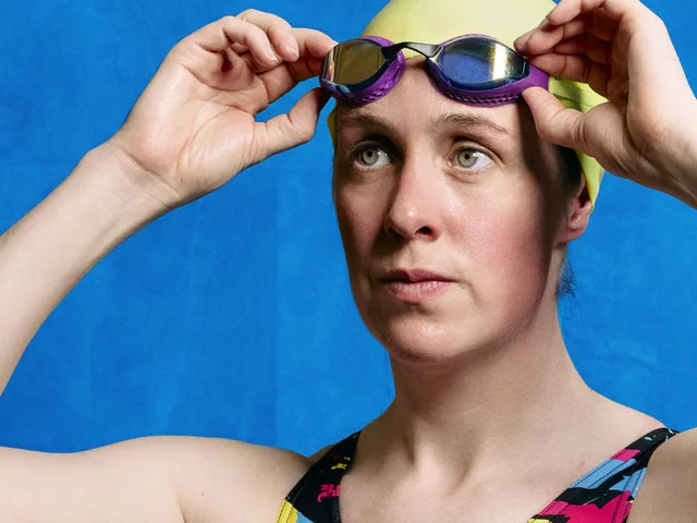 A swimmer wearing WUKA swimwear, goggles pushed up onto her cap