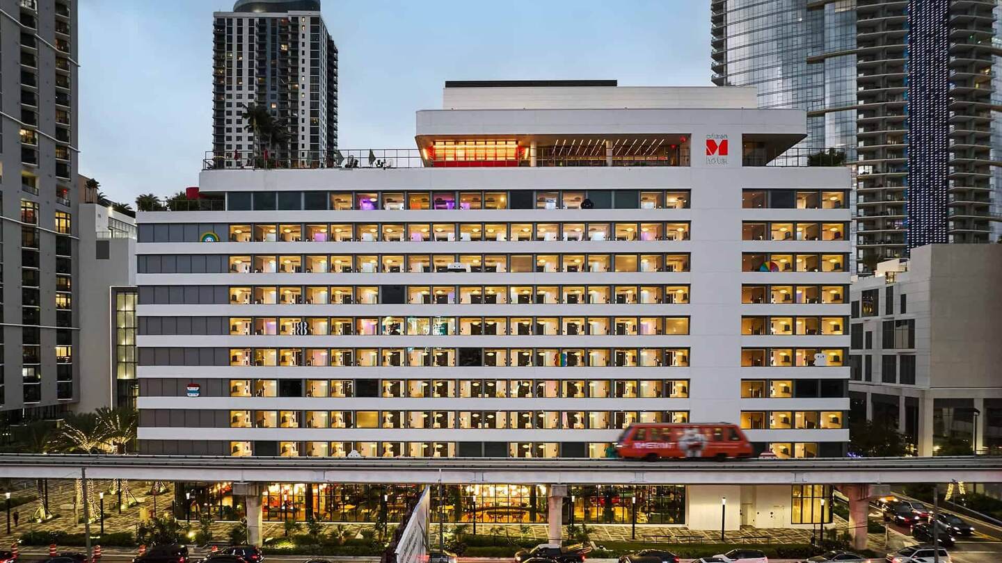 citizenM Miami Worldcenter at dusk, the hotel front lit across ten floors